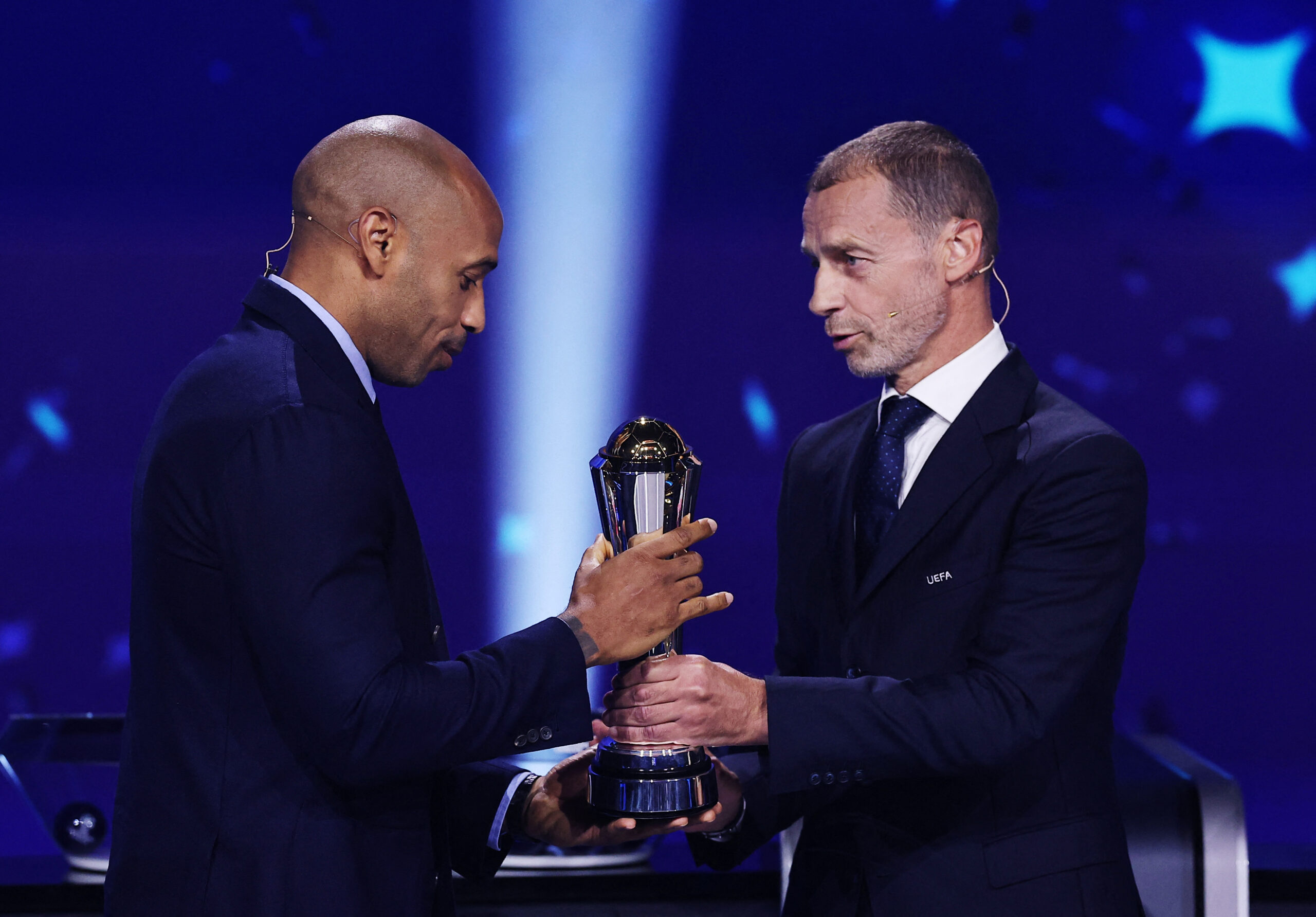UEFA Champions League – League Phase Draw Soccer Football - UEFA Champions League - League Phase Draw - Grimaldi Forum, Monaco - August 27, 2026 Former footballer Thierry Henry receives the UEFA president's award from UEFA president Aleksander Ceferin ahead of the league phase draw REUTERS/Manon Cruz