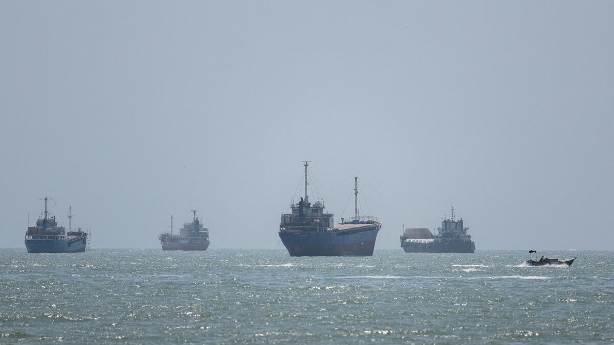 Vessels in the Strait of Hormuz are visible near the beach of Bandar Abbas, Iran, August 26, 2026.