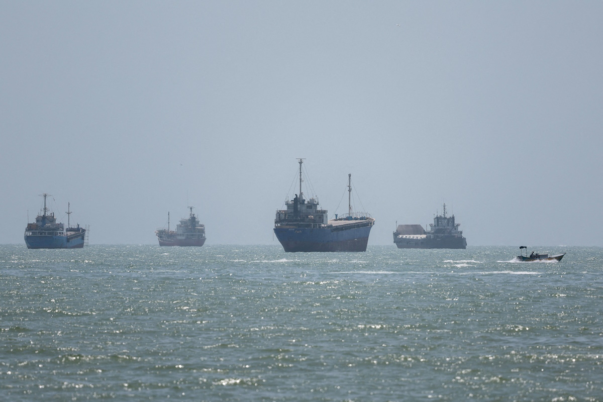 Vessels in the Strait of Hormuz are visible near the beach of Bandar Abbas, Iran, August 26, 2026.