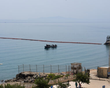 Civil Guard boats patrol alongside floating barriers off the coast of the Spanish enclave of Ceuta, Saturday, Aug. 1, 2026.