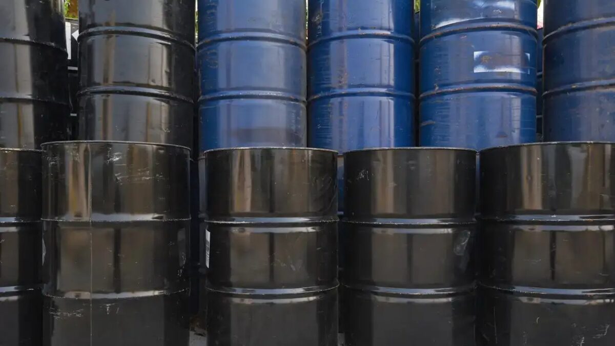 old oil barrels or chemical drums stacked up, industry oil barrel