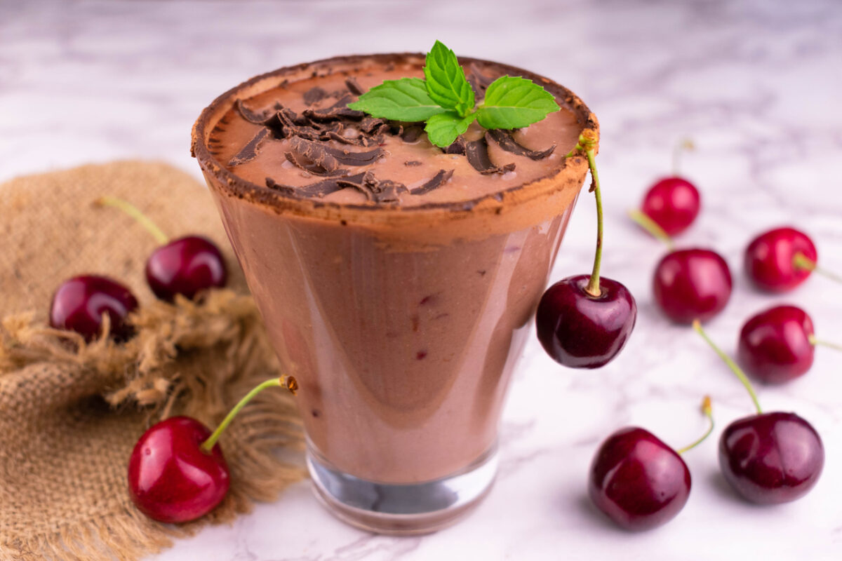 Chocolate smoothie with sour cherries. Close-up.