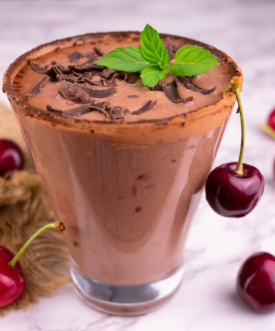 Chocolate smoothie with sour cherries. Close-up.