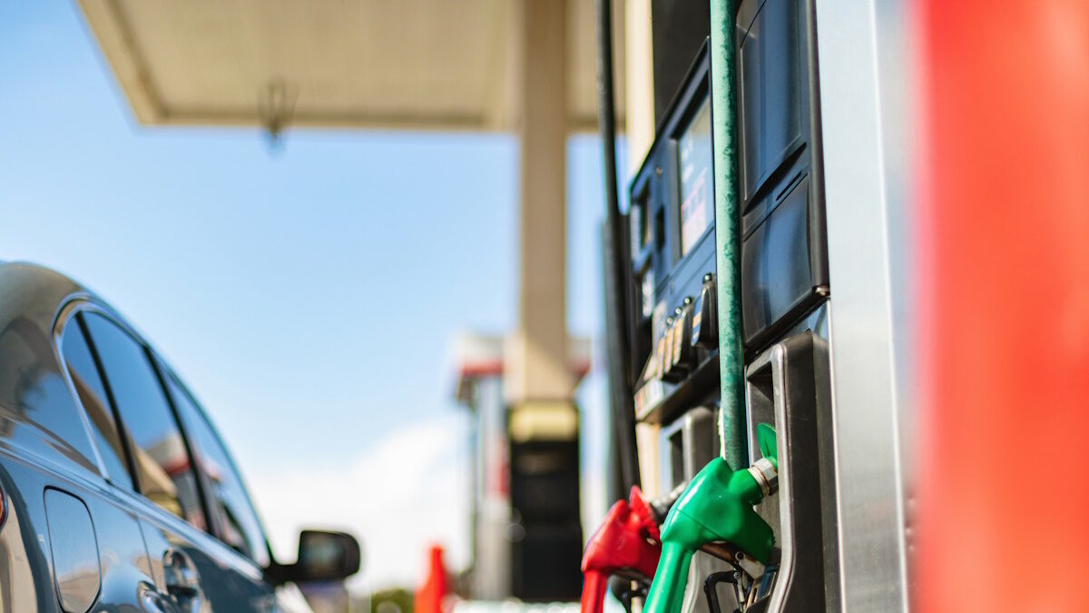 Western USA Economy and Inflation Filling Gas Tank Viewing Sales Price at The Pump Photo Series