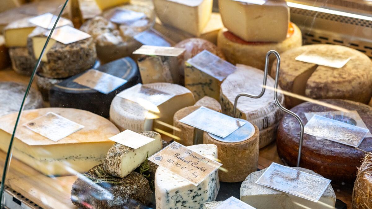 Assortment of French cheeses on display in Fromagerie display window in France