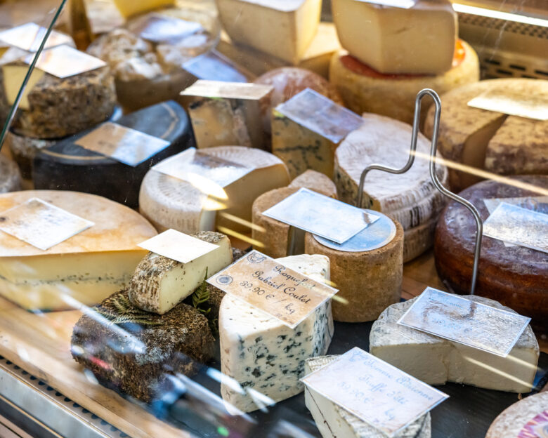 Assortment of French cheeses on display in Fromagerie display window in France