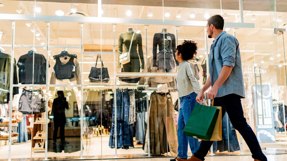 Couple walking through shopping mall