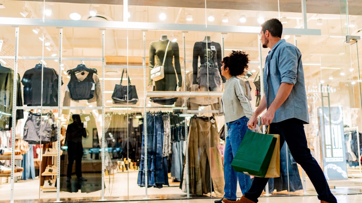 Couple walking through shopping mall
