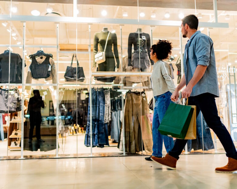 Couple walking through shopping mall