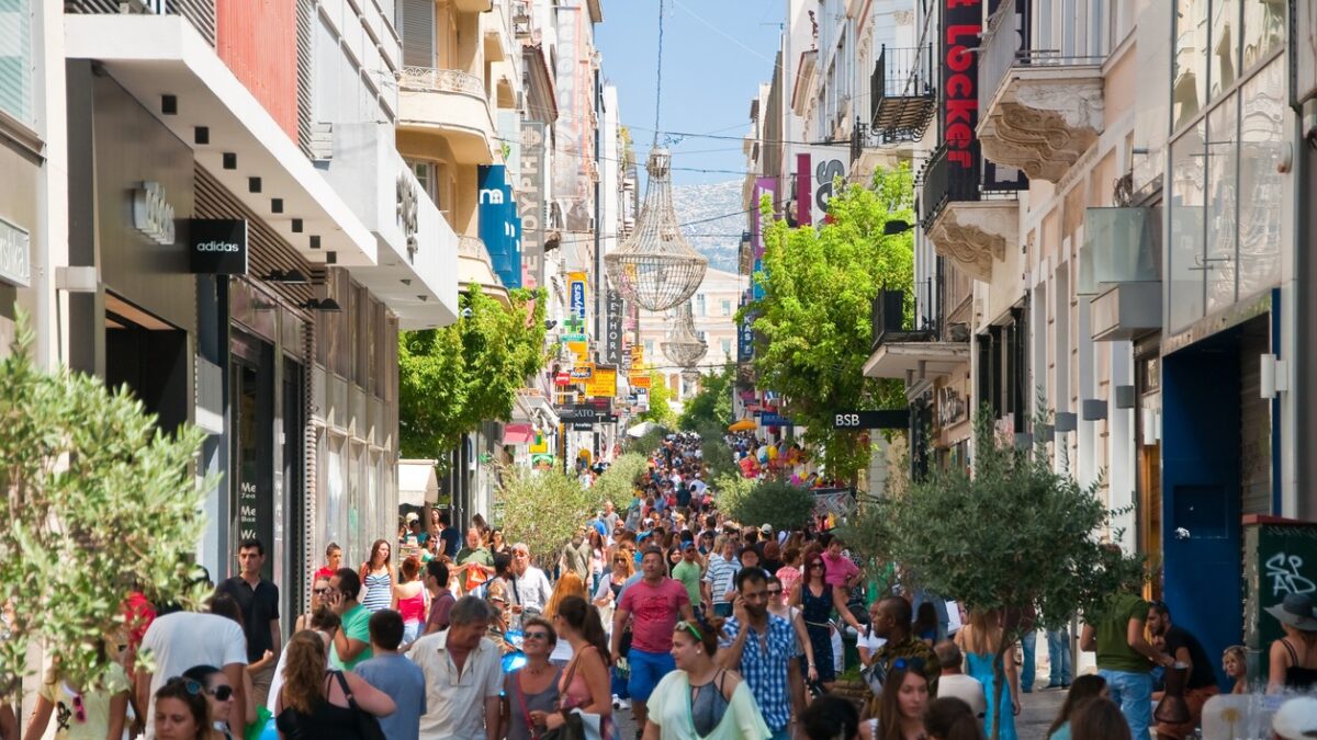 Athens, Greece - August 3, 2013: Shopping on Ermou Street, crowd of customers go shopping.