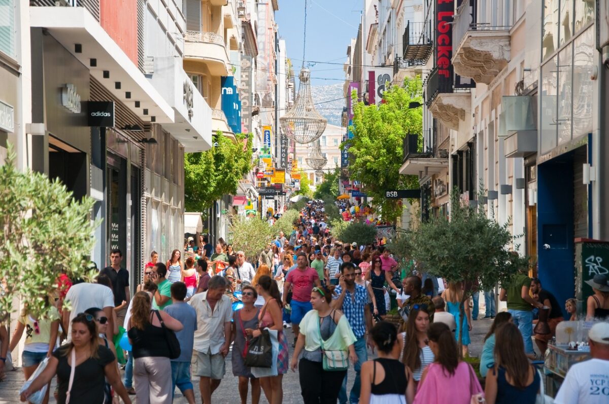 Athens, Greece - August 3, 2013: Shopping on Ermou Street, crowd of customers go shopping.
