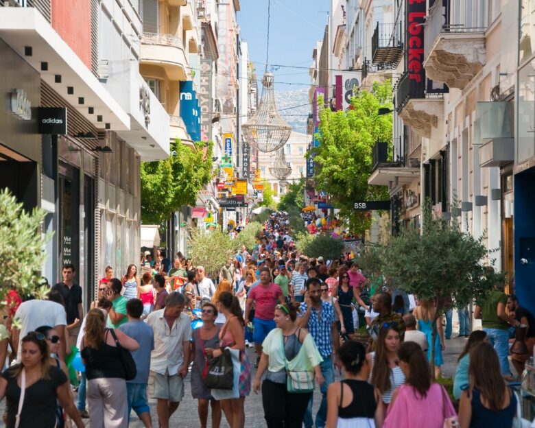 Athens, Greece - August 3, 2013: Shopping on Ermou Street, crowd of customers go shopping.