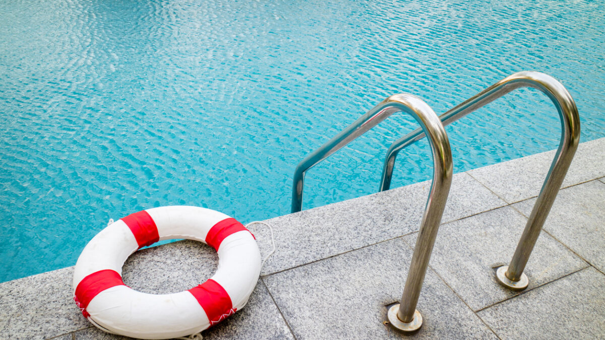 Life ring at swimming pool.emergency tire floating at swimming pool.