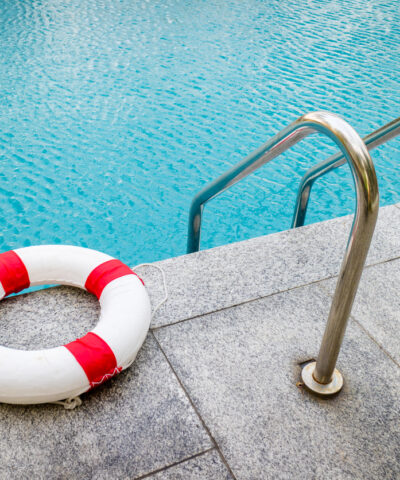 Life ring at swimming pool.emergency tire floating at swimming pool.