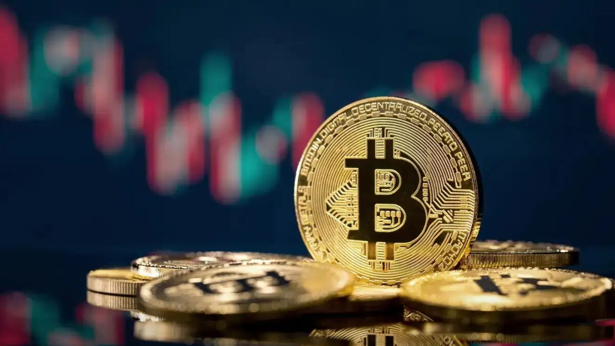 Golden bitcoin coin over defocused stock chart with copy space, Olsztyn, Poland 13 July 2021