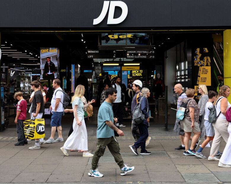 People walk past a JD Sports store in London, Britain, August 19, 2026.