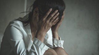 Young depressed woman, domestic and rape violence,beaten and raped sitting in the corner, Domestic violence.