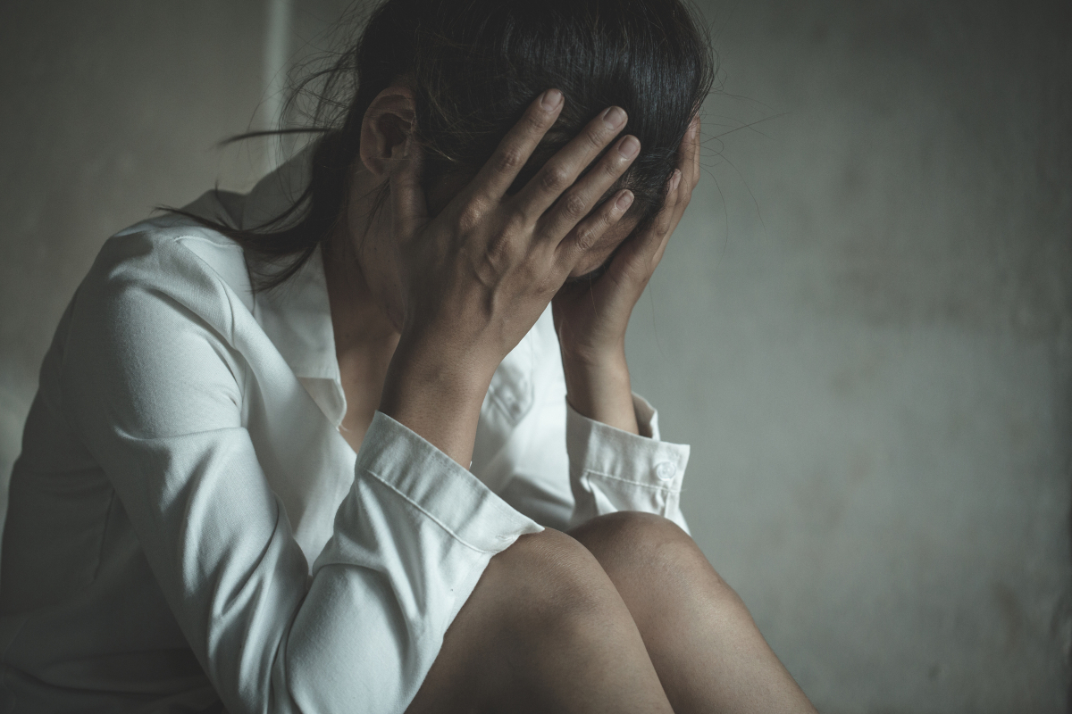 Young depressed woman, domestic and rape violence,beaten and raped sitting in the corner, Domestic violence.