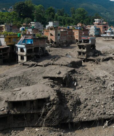 A drone view shows mud covering properties following a flash flood at Trishuli in Nuwakot district, Nepal, August 26, 2026. REUTERS/Stringer
