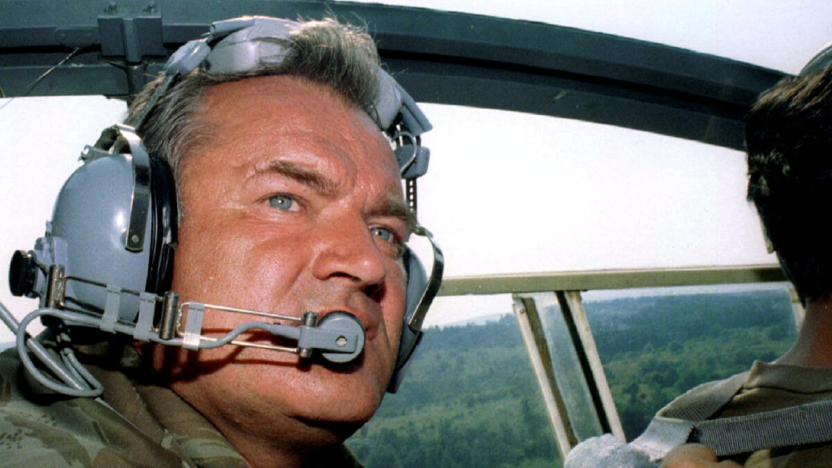 FILE PHOTO: Bosnian Serb army Commander General Ratko Mladic wears head-phones while travelling in helicopter near the eastern Bosnian town of Zepa July 29, 1995. An offensive by Croatian forces has driven up to 20,000 Serb refugees from their homes deeper into Bosnia and southwards into Serb-held Krajina in Croatia. Picture taken July 29, 1995. REUTERS/File Photo