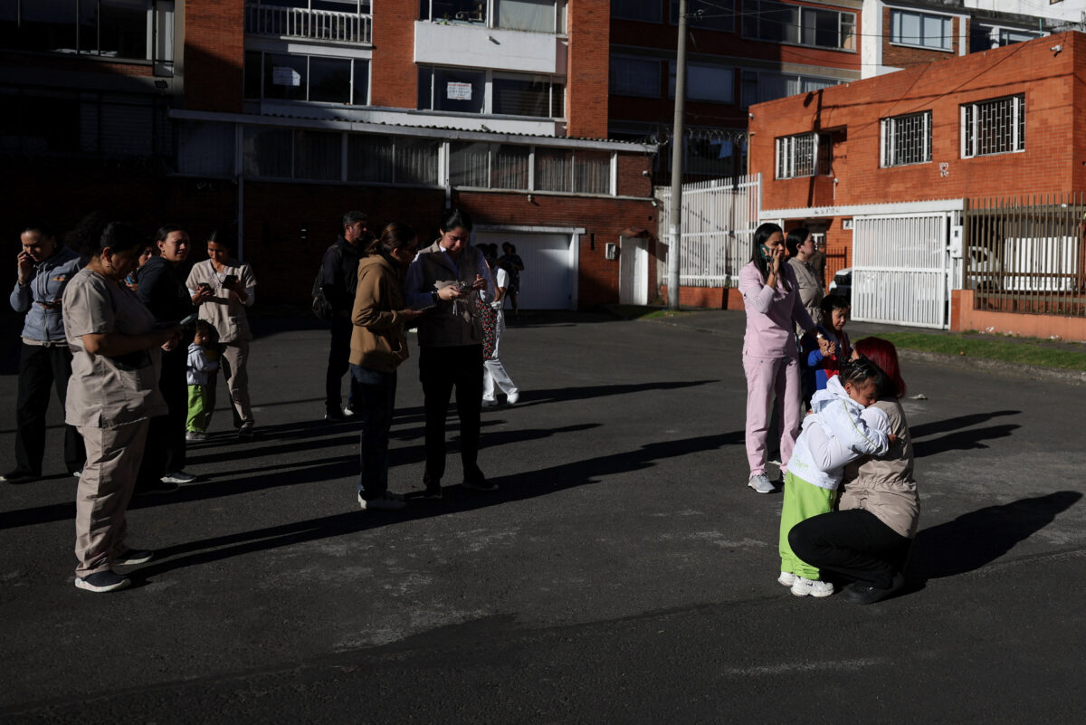 People gather outside a building following an earthquake in Bogota, Colombia, August 10, 2026. REUTERS