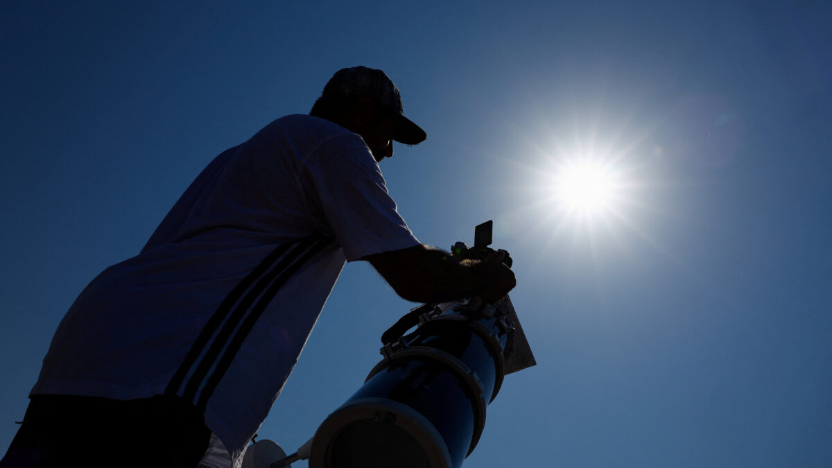 Frenchman Leyssalle Anthony, 39, prepares a telescope to view the total solar eclipse from the beach, in Arija, Spain, August 12, 2026. REUTERS/Borja Suarez
