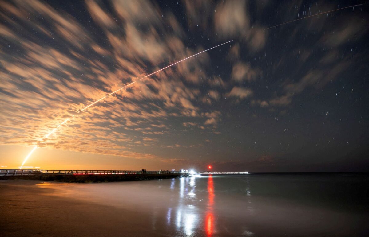 FILE PHOTO: The SpaceX Falcon 9 rocket carrying Starlink satellites is seen over Sebastian Inlet after launching from Cape Canaveral, Florida, U.S., February 26, 2025. REUTERS