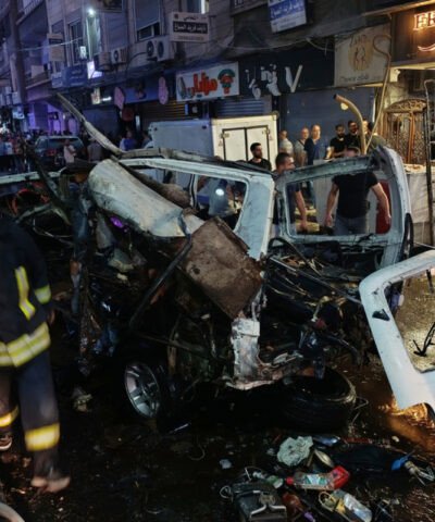 Syrian firefighters and first responders inspect damaged vehicles at the site of an explosion in the Jaramana suburb of Damascus, Syria, Thursday, Aug. 6, 2026. (AP Photo