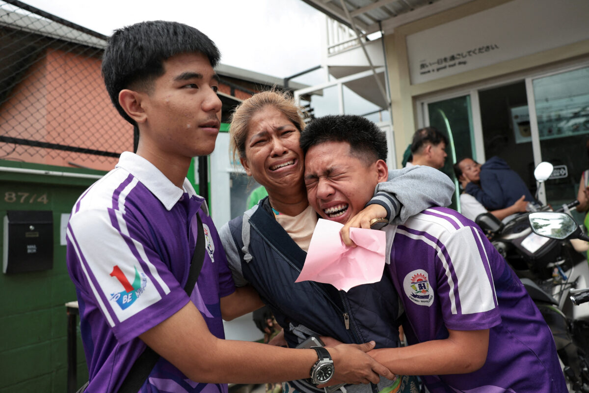 Students react with a relative after being evacuated from Debsirin Nonthaburi School, the site of a shooting incident, in Bang Kruai district in Nonthaburi province on the outskirts of Bangkok, Thailand, August 7, 2026. REUTERS