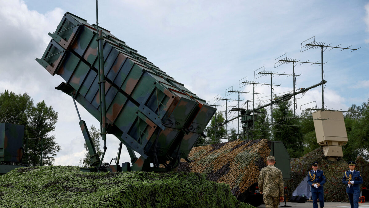 FILE PHOTO: Ukrainian service members walk next to a launcher of a Patriot air defence system, amid Russia's attack on Ukraine, in an undisclosed location, Ukraine August 4, 2024. REUTERS/Valentyn Ogirenko/File Photo/File Photo