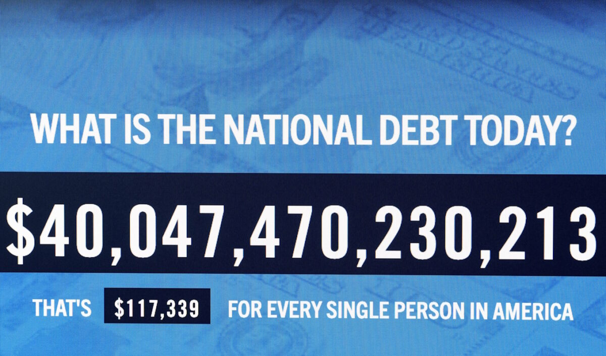A screen displays the total U.S. National Debt, which surpassed $40 trillion for the first time according to the Treasury Department, in New York City, U.S., August 19, 2026.  REUTERS