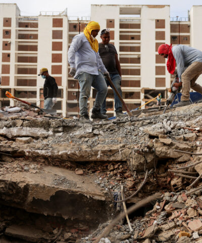 People search for the bodies of their loved ones beneath the rubble, after earthquakes rocked Venezuela on June 24, killing and displacing thousands of people, in Caraballeda, La Guaira, Venezuela, July 29, 2026. REUTERS/Gaby Oraa