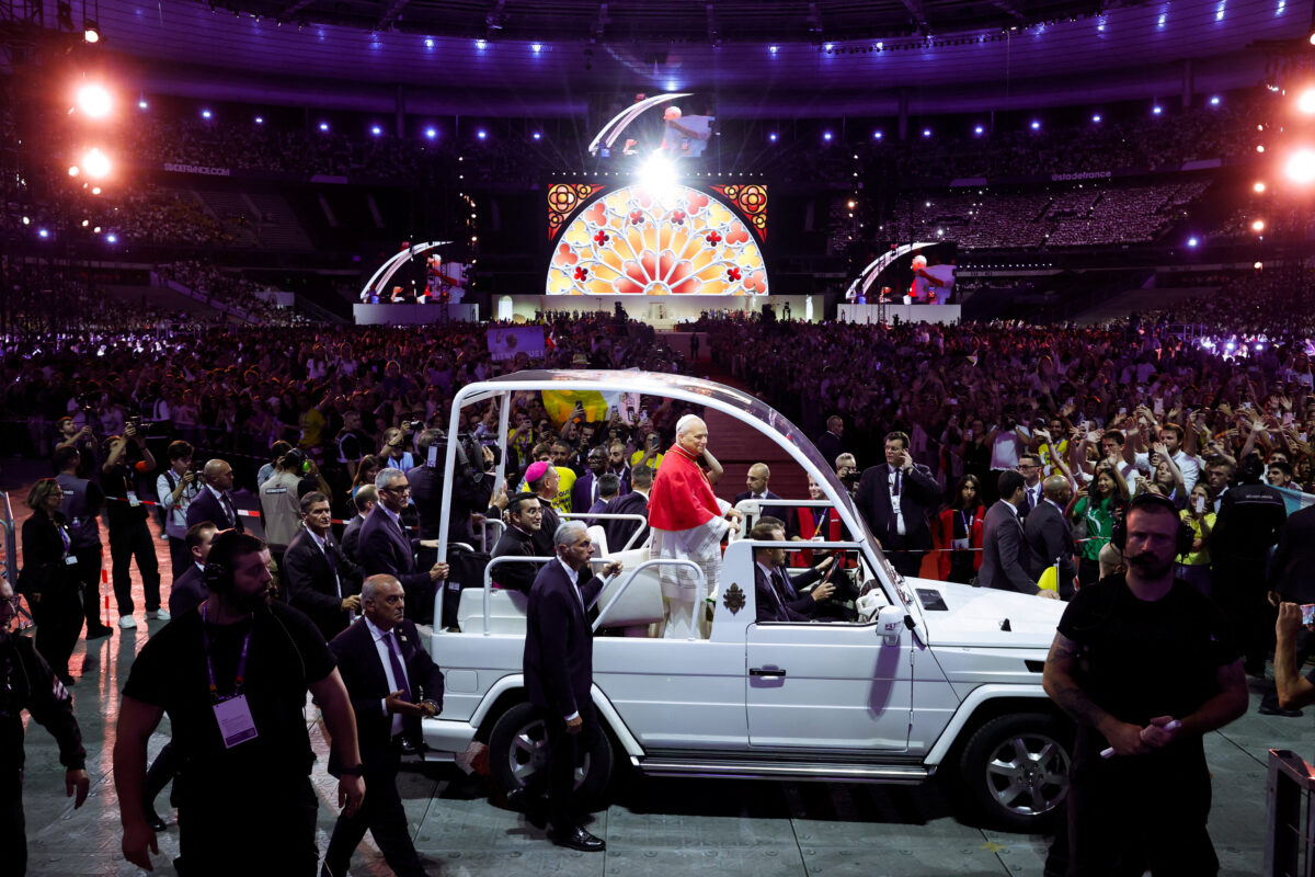 Pope Leo rides the popemobile as he arrives for a prayer vigil with young people at the Stade de France in Saint-Denis, France, September 25, 2026. REUTERS