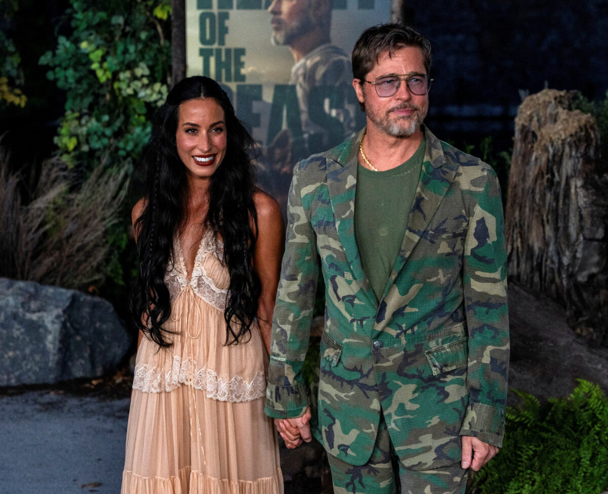 Brad Pitt and his girlfriend Ines de Ramon walk the carpet ahead of the global premiere of "Heart of the Beast" at the FirstBank Amphitheater in Franklin, Tennessee, U.S., September 16, 2026. REUTERS