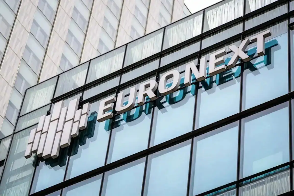 The Euronext stock exchange logo at the company's headquarters in the Paris financial district of La Defense, France, 23 March 2023. Euronext is a pan-European market infrastructure, connecting European economies to global capital markets. It operates regulated exchanges in Belgium, France, Ireland, Italy, the Netherlands, Norway and Portugal.