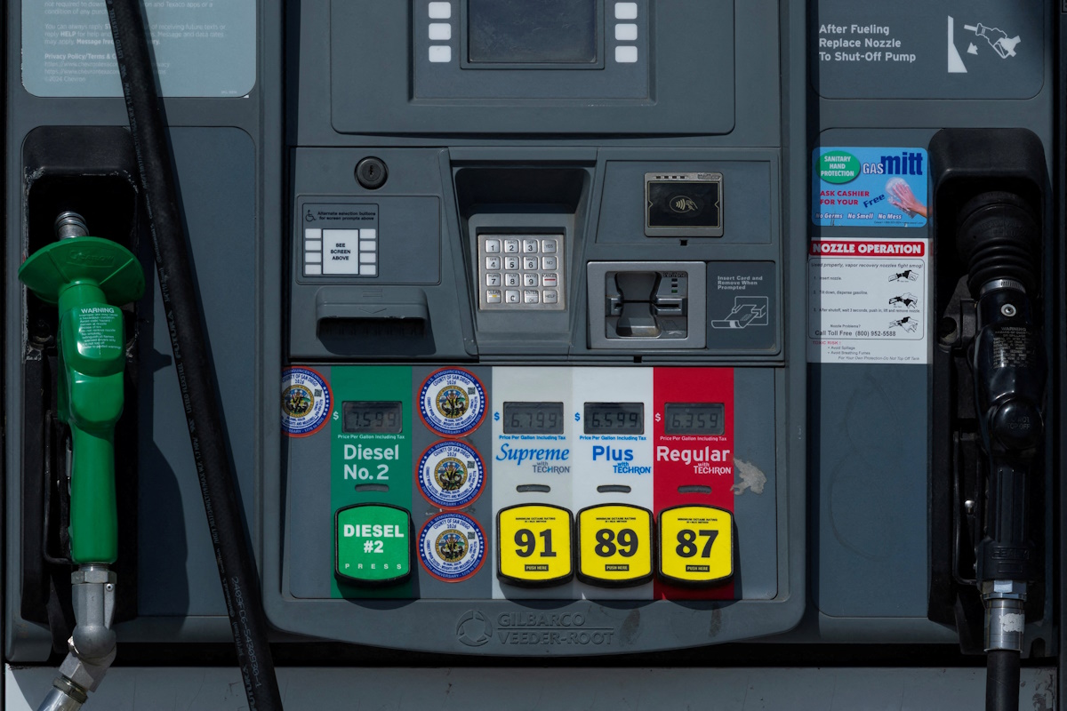 FILE PHOTO: The price of gasoline is displayed on gas pumps at the gas station near the highway in Encinitas, California, U.S., April 30, 2026.
