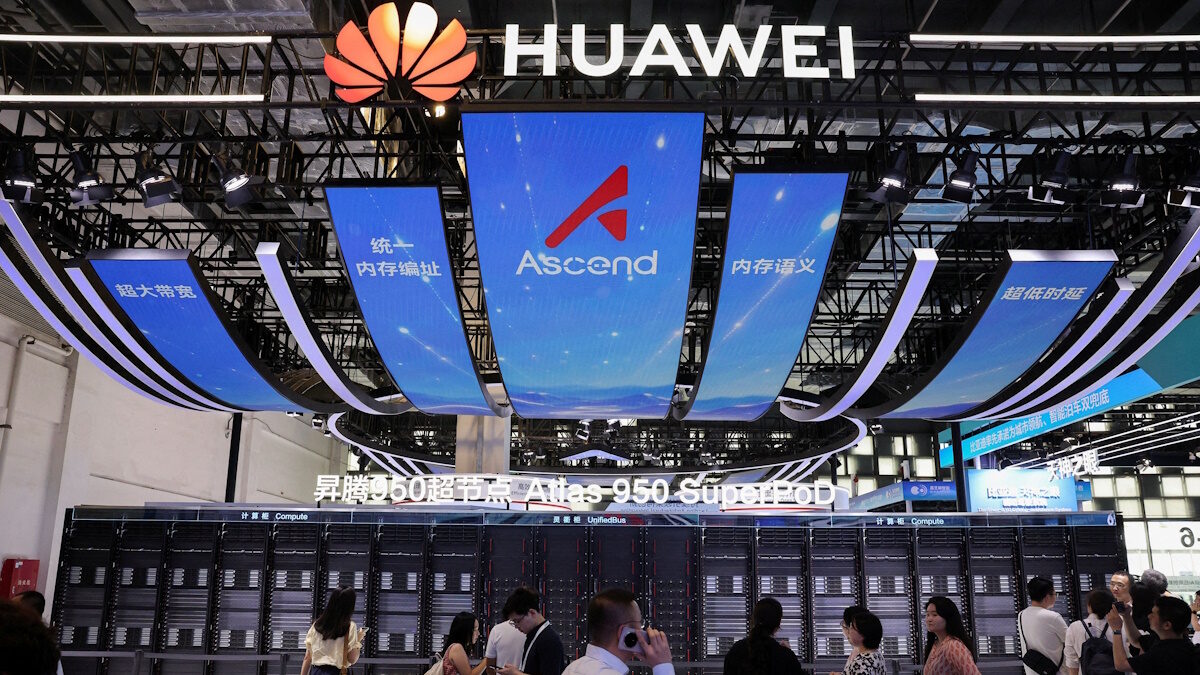 FILE PHOTO: People walk past the Huawei booth, where the Atlas 950 SuperPoD system is displayed, during the World Artificial Intelligence Conference (WAIC) in Shanghai, China, July 17, 2026.