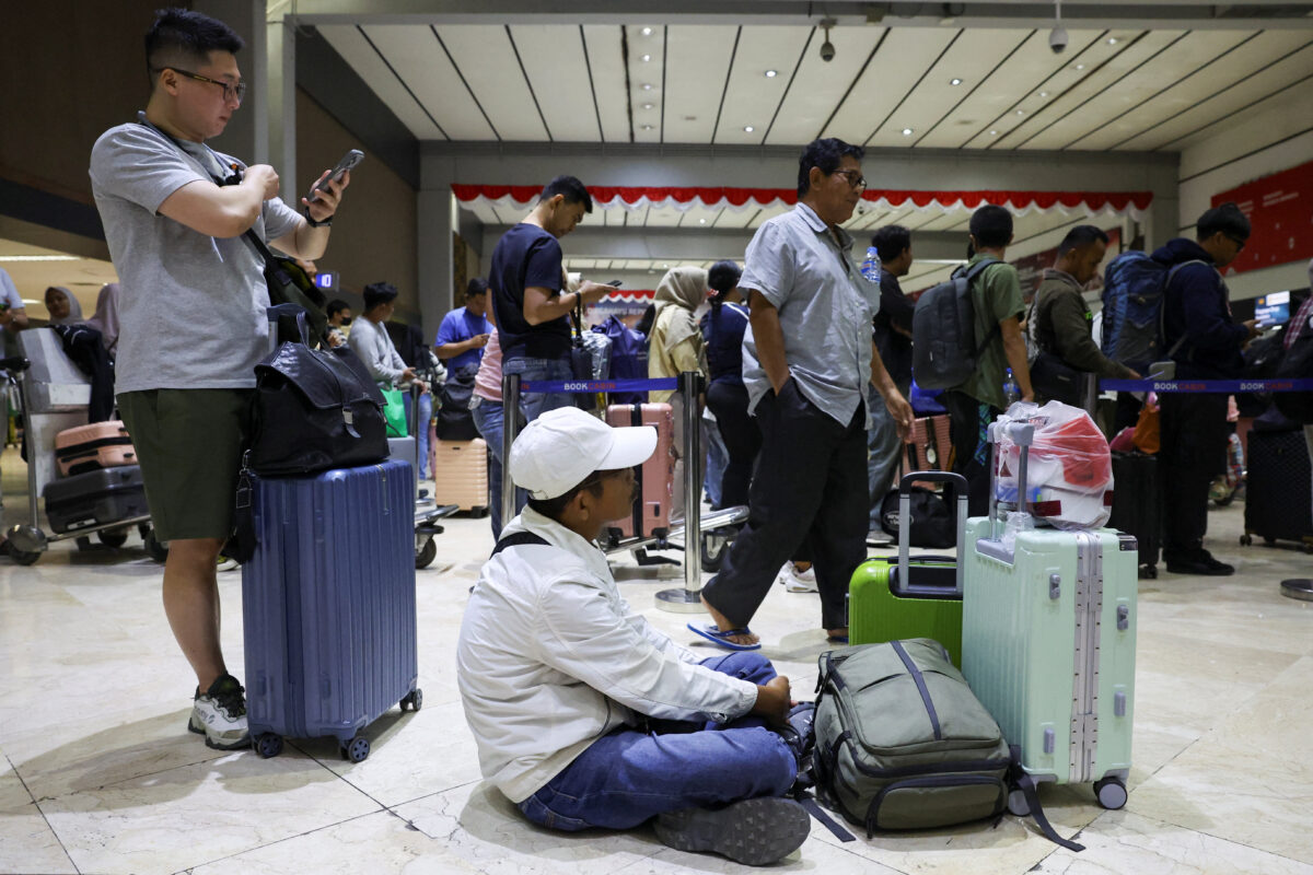 Stranded passengers wait at check-in area as Soekarno Hatta International Airport closed its operations due to the eruption of the Mount Anak Krakatau volcano, in Tangerang, near Jakarta, Indonesia, September 6, 2026. REUTERS