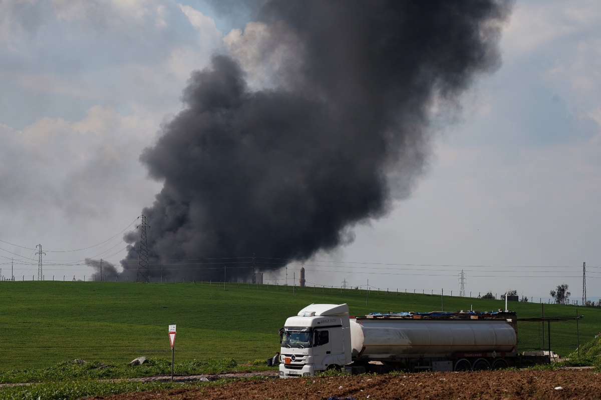 01 April 2026, Iraq, Erbil: Smoke rises from a motor oil depot on the outskirts of Erbil, after it was hit by a drone attack.