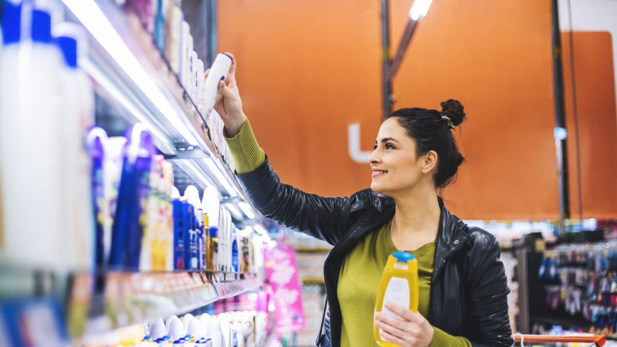 A young woman, housewife, decided to go to the supermarket and buy groceries for his family. the will to cook breakfast, lunch, dinner and everything she wrote on her shopping list. She chooses, fruits, vegetables, wine, cosmetics.