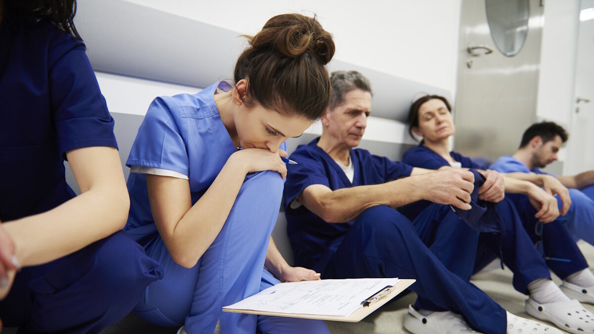 Female doctor examining the medical record