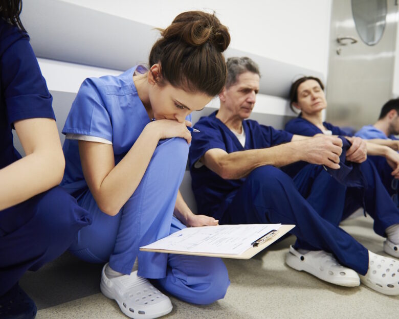 Female doctor examining the medical record