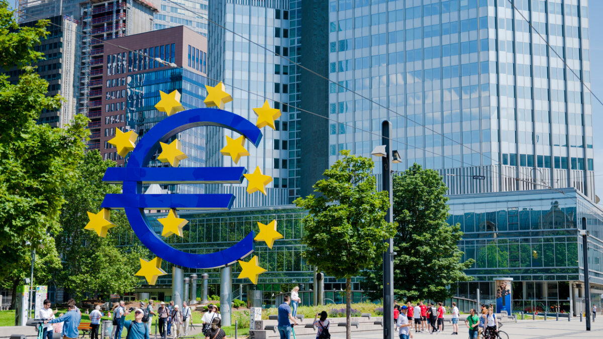 Large Euro symbol sculpture outside the European Central Bank in Frankfurt Main, Germany. People clearly visible ECB-People