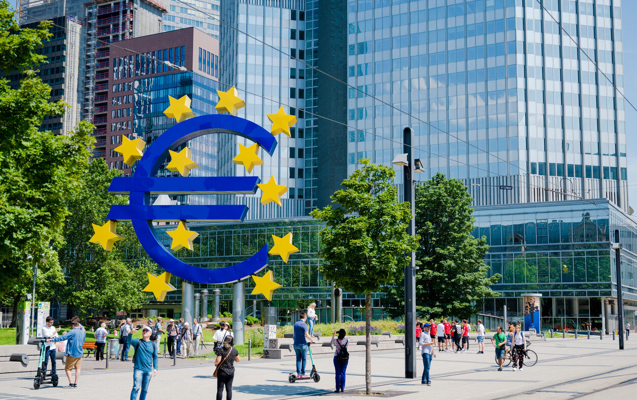 Large Euro symbol sculpture outside the European Central Bank in Frankfurt Main, Germany. People clearly visible ECB-People