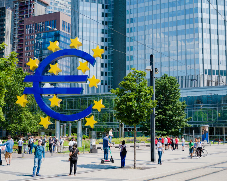 Large Euro symbol sculpture outside the European Central Bank in Frankfurt Main, Germany. People clearly visible ECB-People