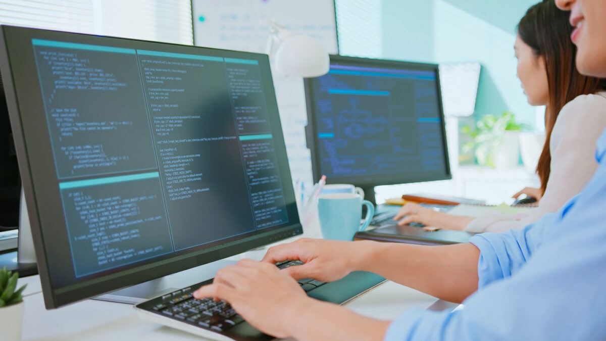 asian IT department or engineer colleagues team work by computer at workplace