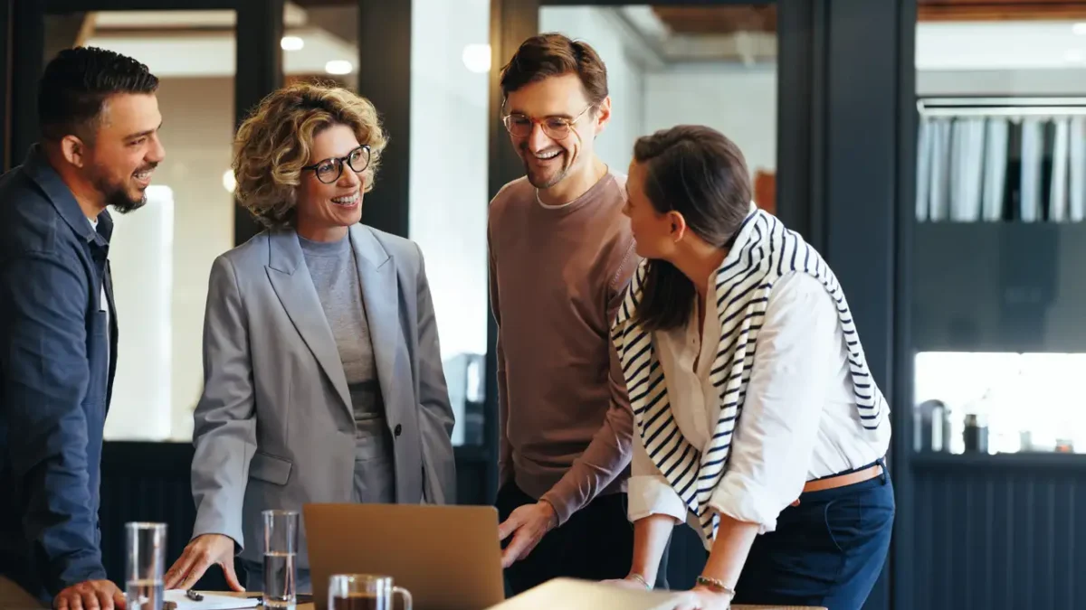 Group of business people having a meeting in a tech company. Creative business professionals planning a project in an office. Teamwork and collaboration in a modern workplace.