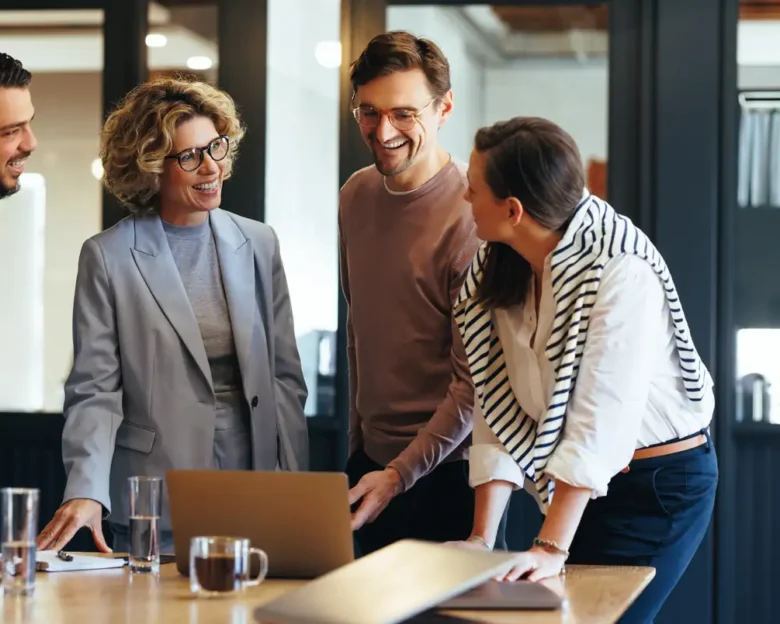 Group of business people having a meeting in a tech company. Creative business professionals planning a project in an office. Teamwork and collaboration in a modern workplace.