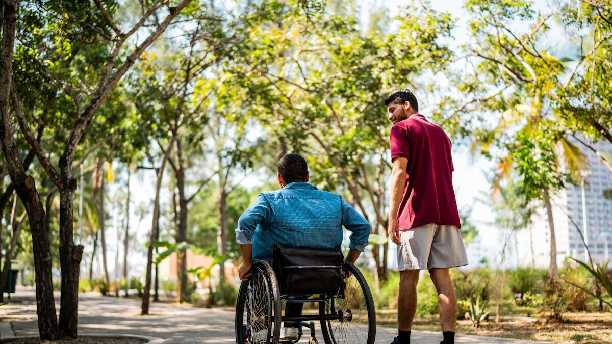 Friends talking and walking on public park