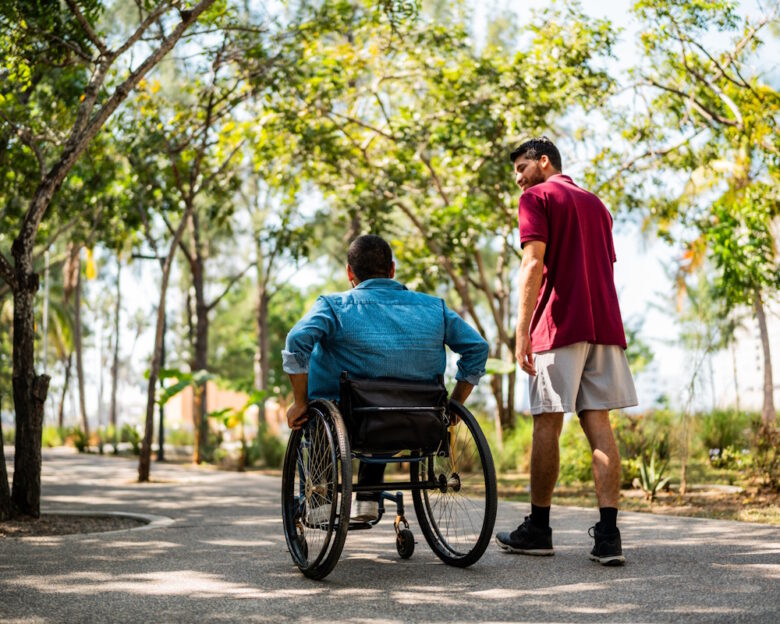 Friends talking and walking on public park